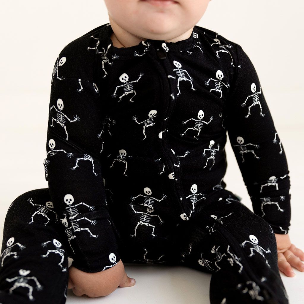 Load image into Gallery viewer, Posh Peanut Dancing Skelly Zippered Footie
